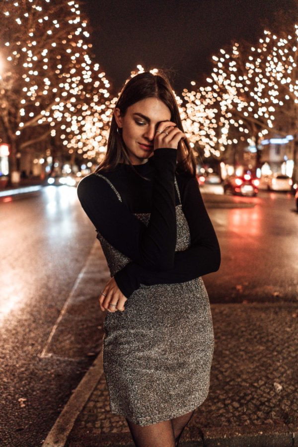 Sparkly Silver Mini Dress Layered Over Black Top Sparkly Silver Mini Dress Layered Over Black Top — New Years Eve Outfits 2027