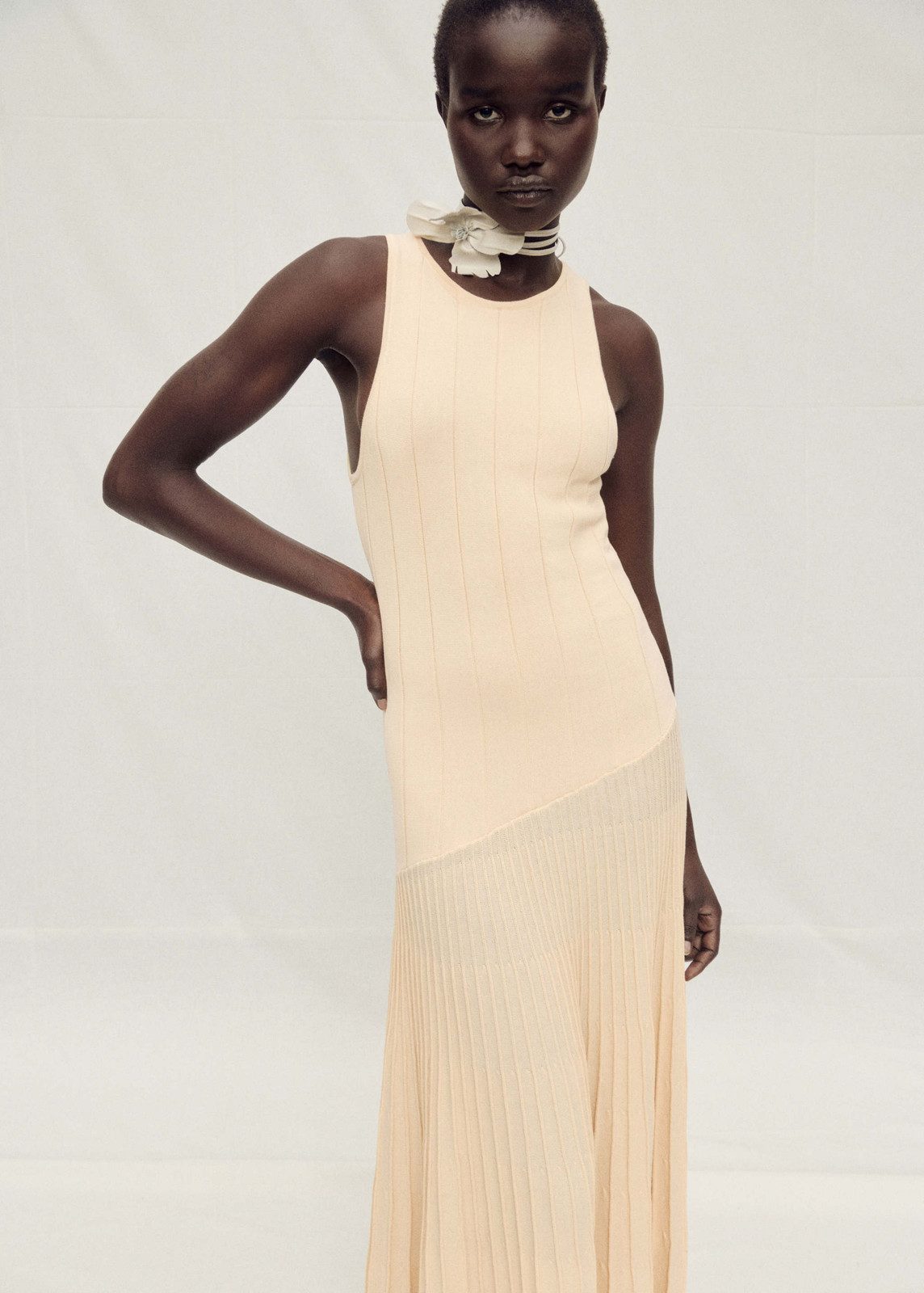 Pale Yellow Ribbed Knit Dress with Asymmetric Pleated Hem Pale Yellow Ribbed Knit Dress with Asymmetric Pleated Hem — Pleated Dress 2027