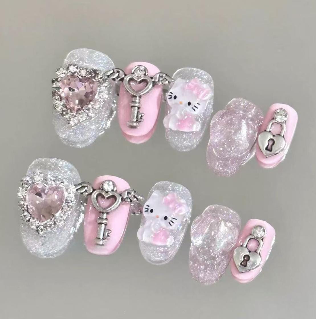 Pink and Silver Medium Oval with Glitter Accents Pink and Silver Medium Oval with Glitter Accents — 3D Hello Kitty Nails 2027