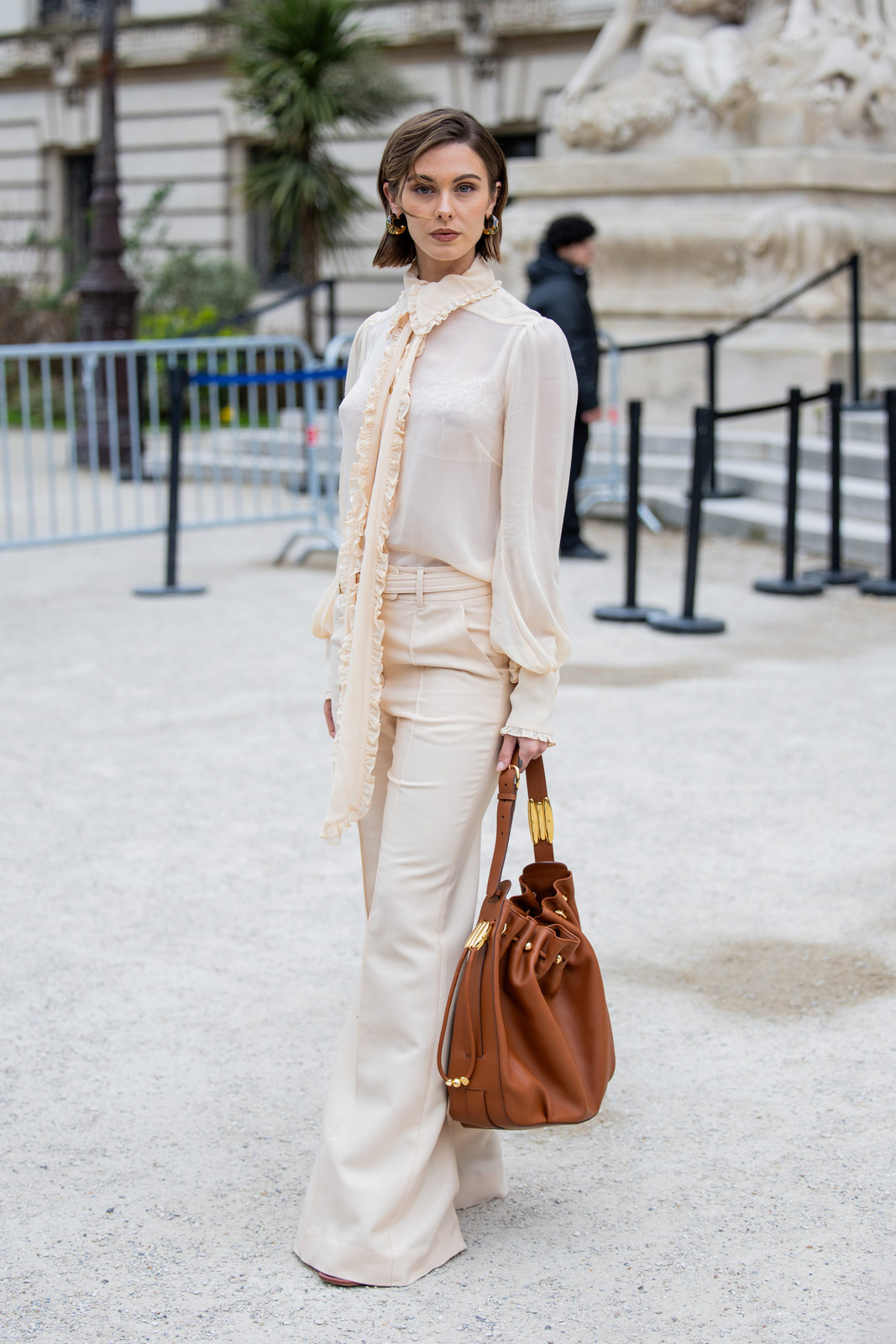 Cream Ruffled Blouse with Pussy-Bow Tie and Wide-Leg Trousers for Workwear Chic Cream Ruffled Blouse with Pussy-Bow Tie and Wide-Leg Trousers for Workwear Chic — Ruffle Top Outfits 2027