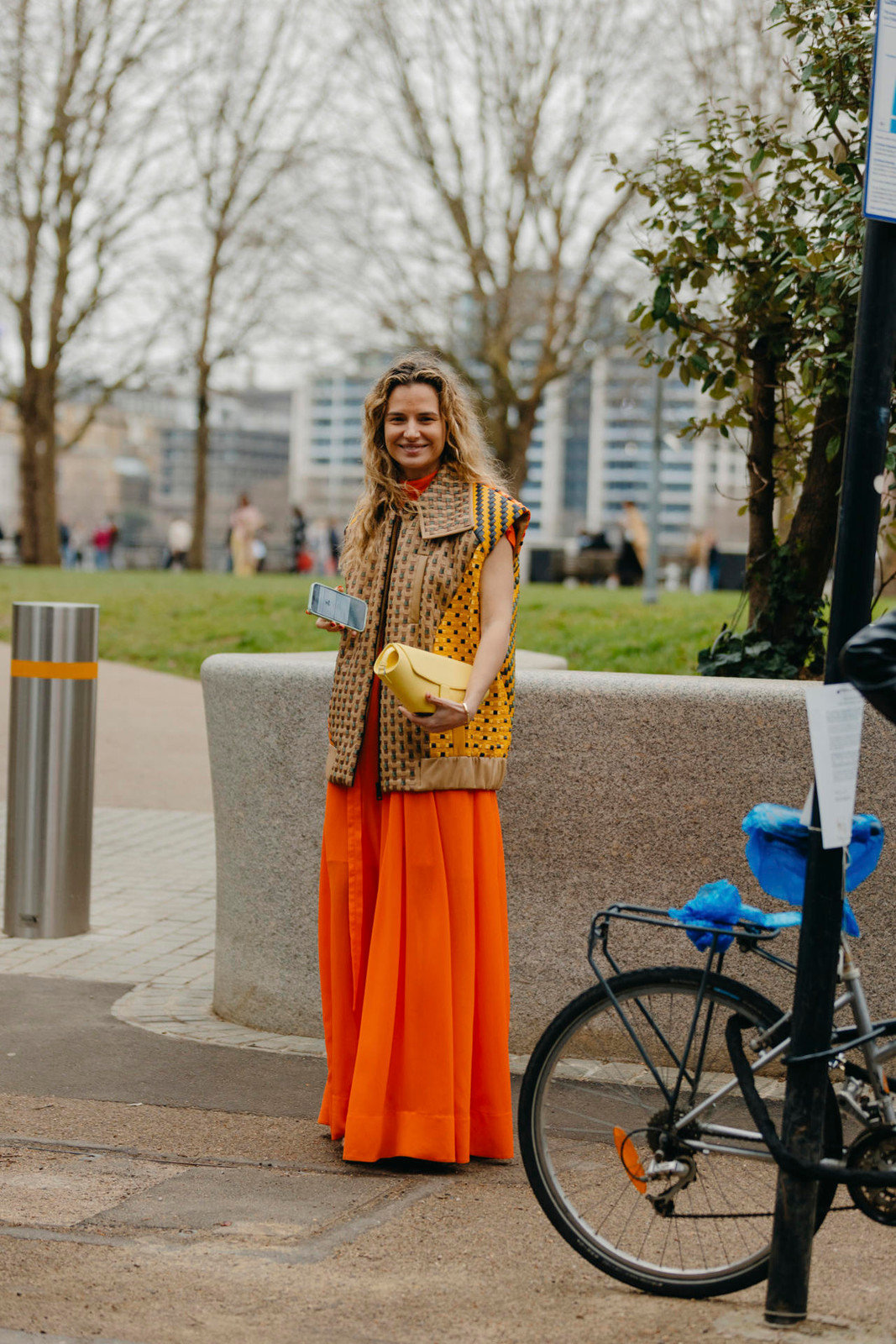 Pattern Play: Printed Vest Over Orange Maxi Dress Pattern Play: Printed Vest Over Orange Maxi Dress — Puffer Vest Outfits 2027