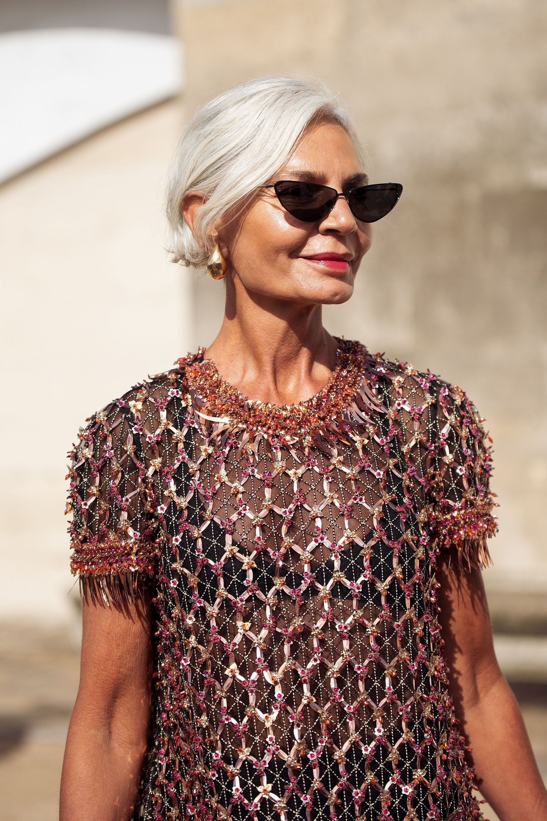 Bold Floral Blouse with Striped Trousers and Pink Pumps Bold Floral Blouse with Striped Trousers and Pink Pumps — Summer Outfits 2027 for Women Over 50