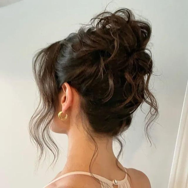 Messy High Bun With Tendrils — Wedding Guest Updos 2027