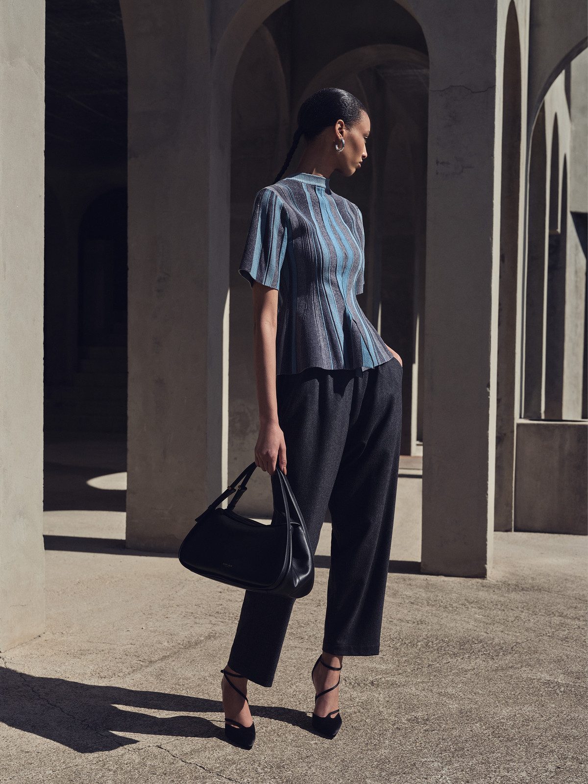 Sophisticated Pleated Knit Top with Dark Grey Trousers — Las Vegas Outfits 2027