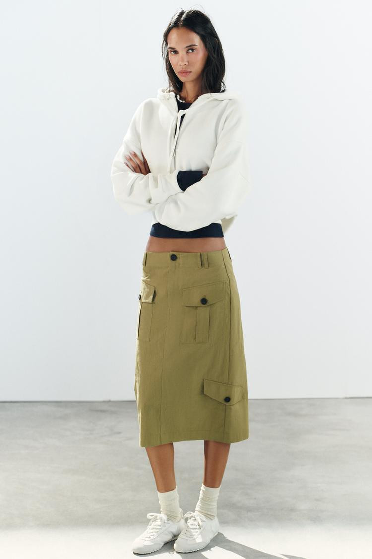 White Cropped Hoodie Navy Blue Bralette Outfit Idea White Cropped Hoodie Navy Blue Bralette Outfit Idea — Cargo Skirt Outfits 2027