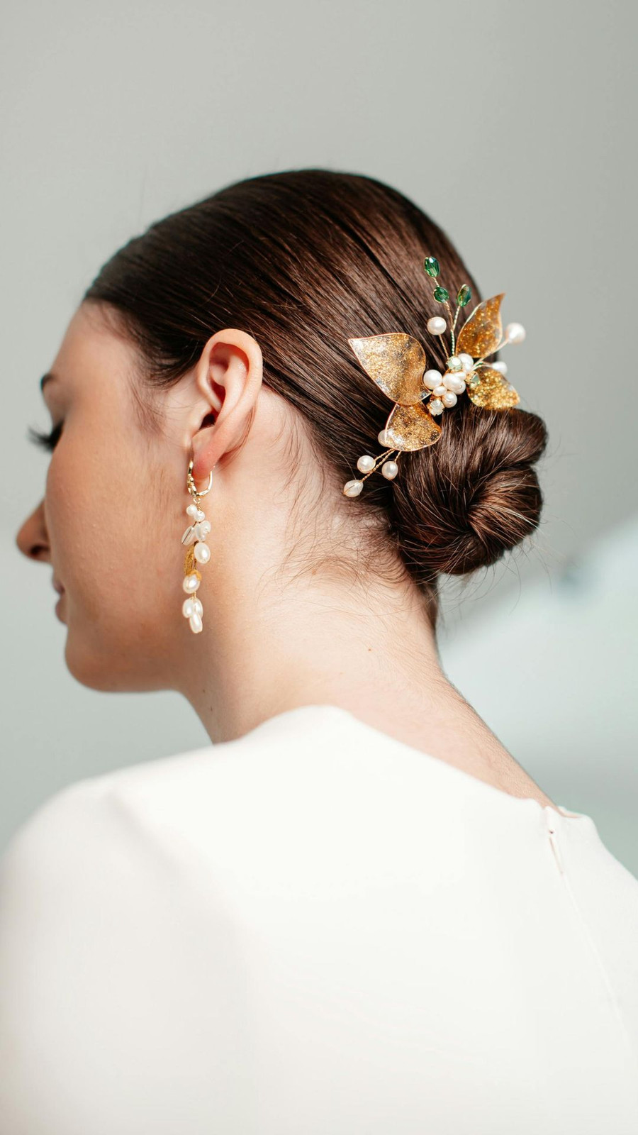 Sleek Dark Chignon With Gold Piece — Wedding Guest Updos 2027