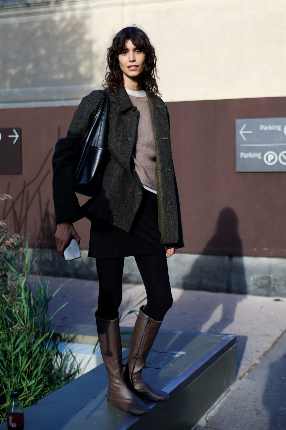 Dark Green Jacket Over Beige Sweater, Black Skirt, and Knee-High Boots Dark Green Jacket Over Beige Sweater, Black Skirt, and Knee-High Boots — Winter Neutral Outfits 2027