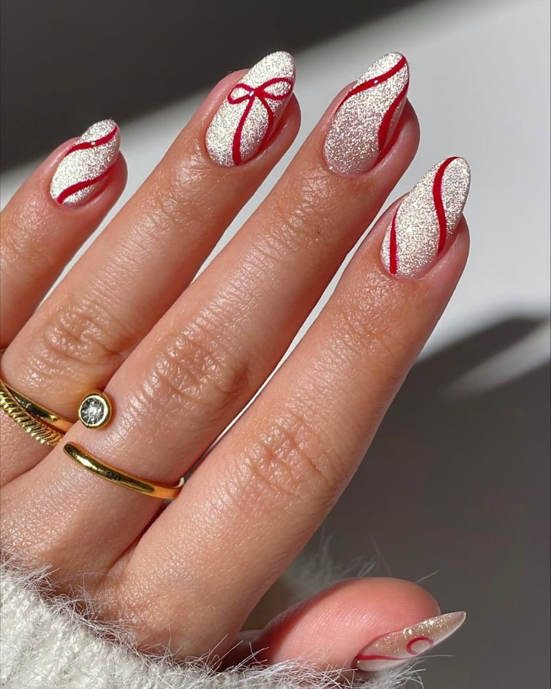 Medium Oval Red Glitter Bow Nails Medium Oval Red Glitter Bow Nails — Christmas Nails 2026