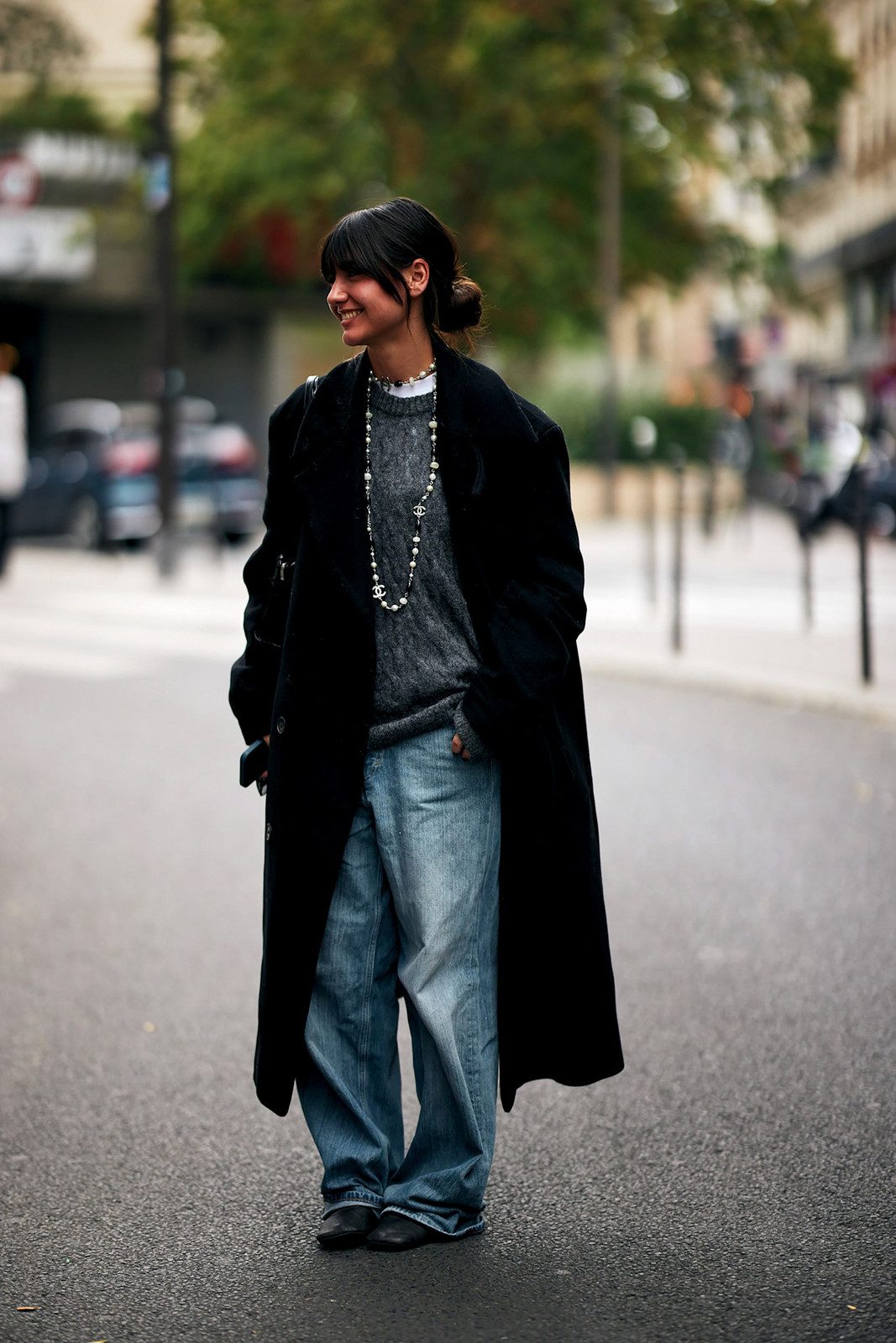 Oversized Black Coat and Pearl Necklace Layered Over Wide-Leg Jeans — Wide Leg Jeans Outfits 2027