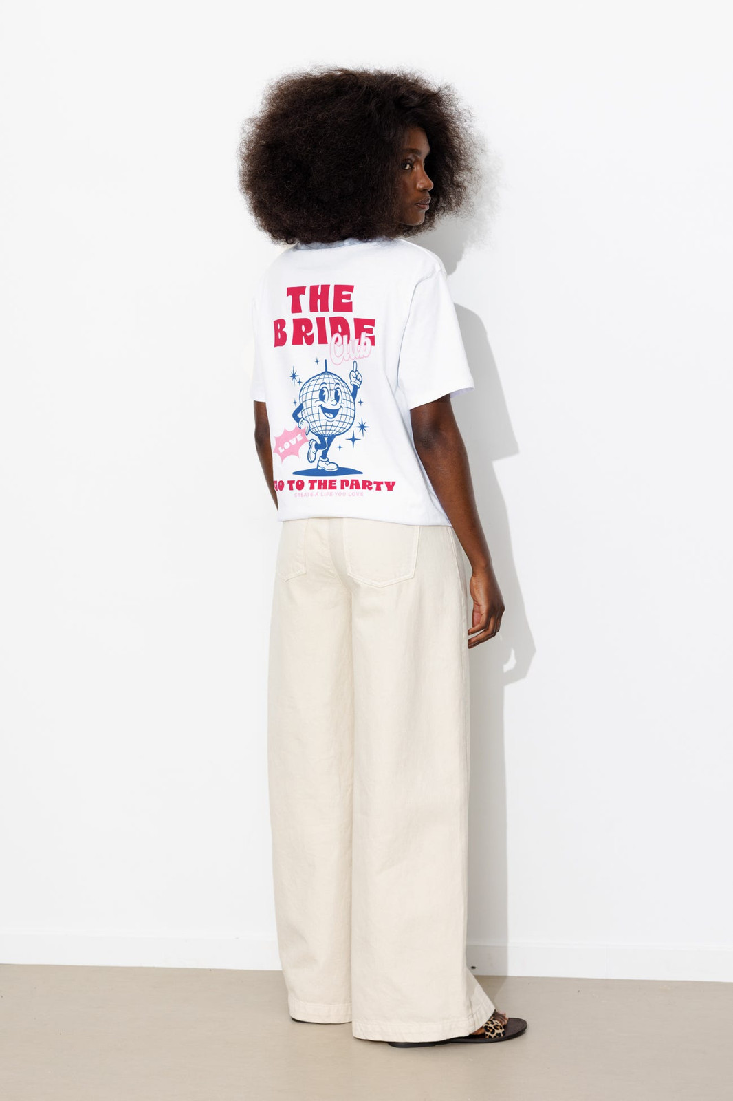 White 'The Bride' Graphic Tee with Leopard Print Sandals White 'The Bride' Graphic Tee with Leopard Print Sandals — Summer Bachelorette Outfits 2027