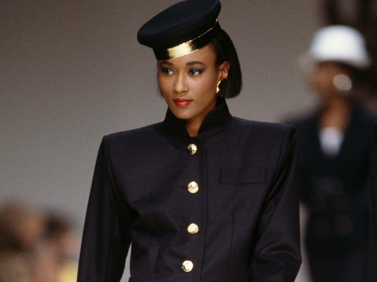 Navy structured jacket with gold buttons and sharp shoulders Navy structured jacket with gold buttons and sharp shoulders — 80s Luxury Outfits 2027