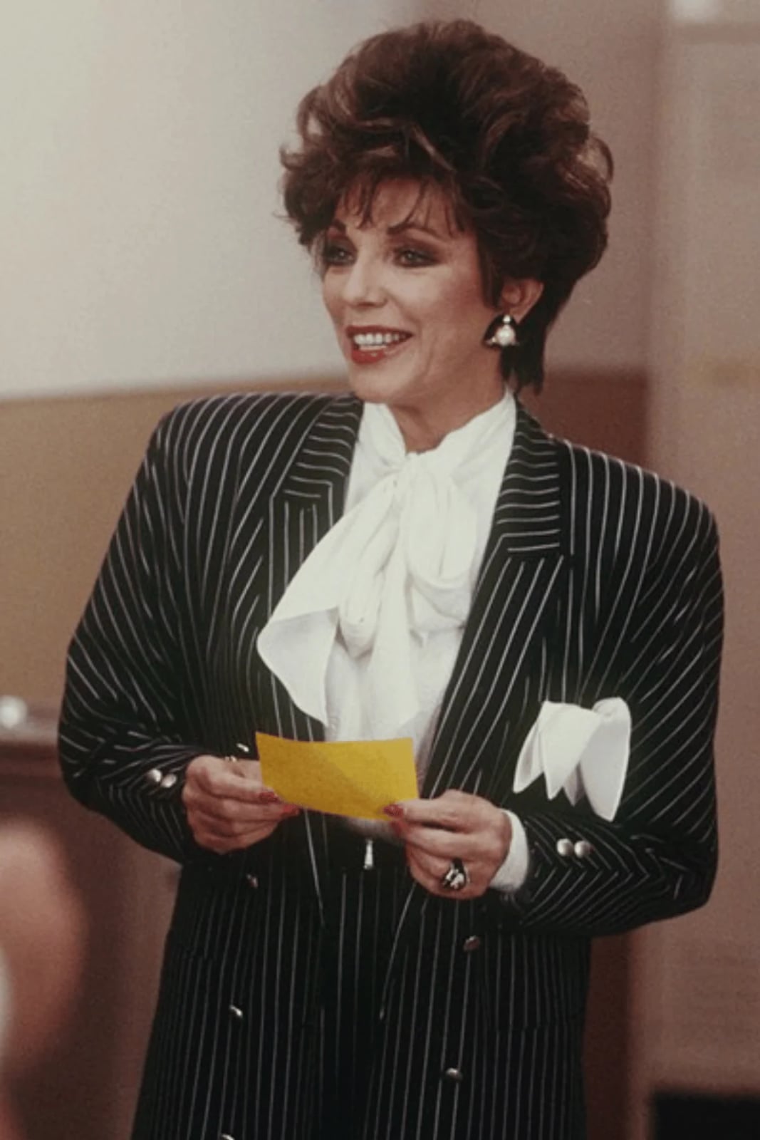 Pinstripe blazer with white pussy-bow blouse Pinstripe blazer with white pussy-bow blouse — 80s Luxury Outfits 2027