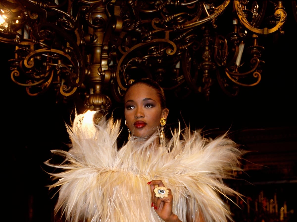 Voluminous cream feathered shoulder piece with gold earrings Voluminous cream feathered shoulder piece with gold earrings — 80s Luxury Outfits 2027