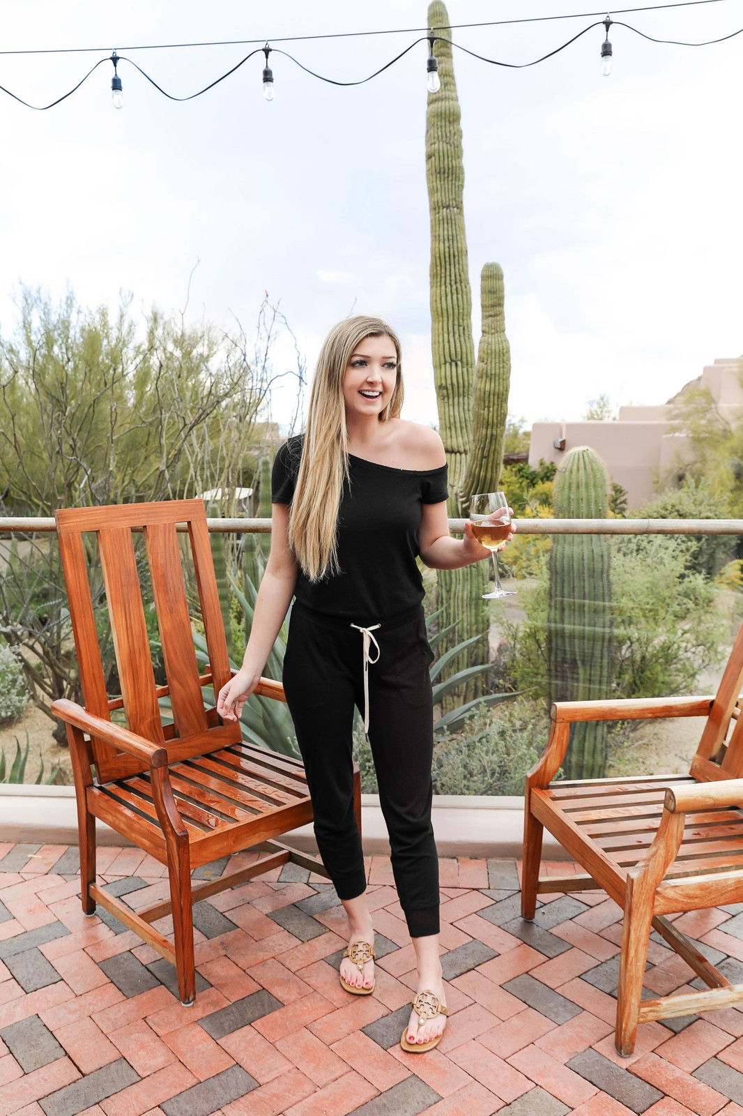 Black Off-the-Shoulder Jumpsuit with Gold Sandals for Chic Comfort — Scottsdale Outfits 2027