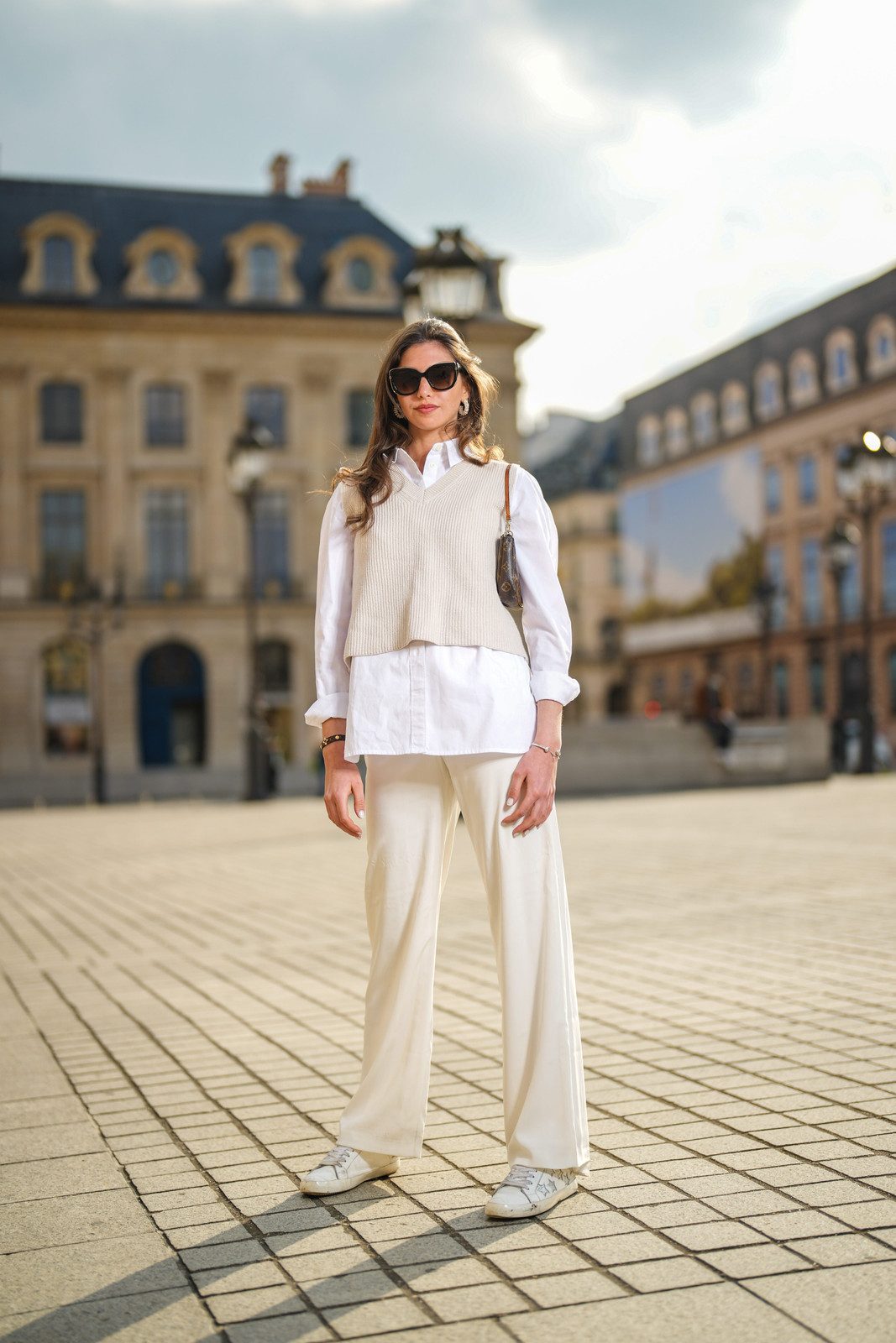 Layered Sophistication: White Trousers with Knit Vest and Button-Down Layered Sophistication: White Trousers with Knit Vest and Button-Down — White Jeans Outfits 2027