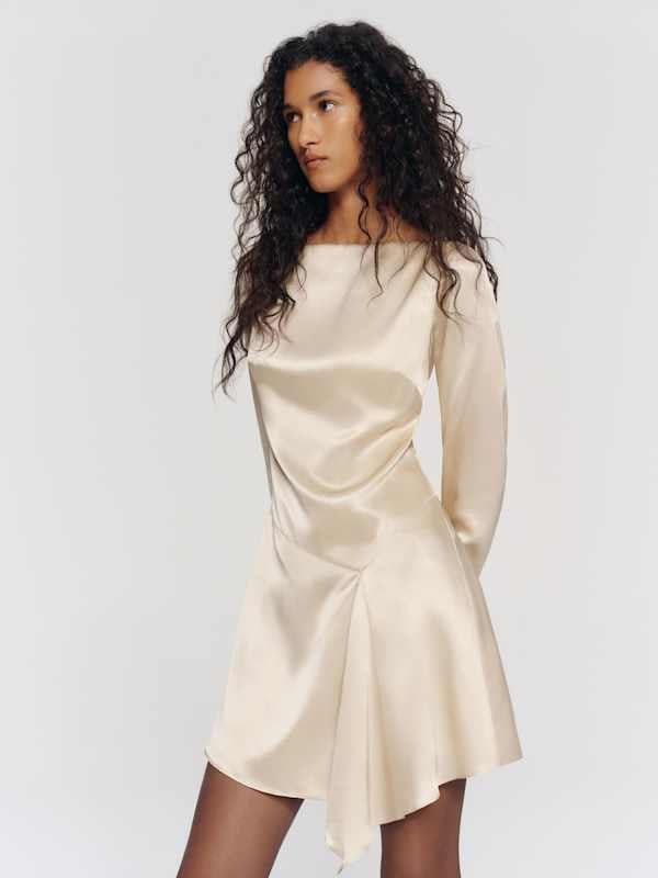 Cream satin long-sleeved mini dress with draped hem Cream satin long-sleeved mini dress with draped hem — Bachelorette Dress 2027 for Guest