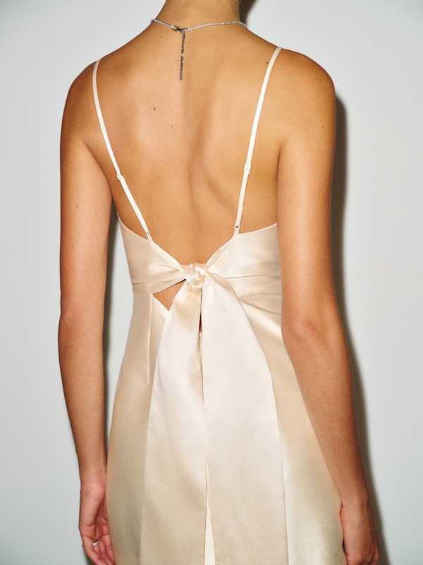 Cream satin slip dress with large back bow Cream satin slip dress with large back bow — Bachelorette Dress 2027 for Guest