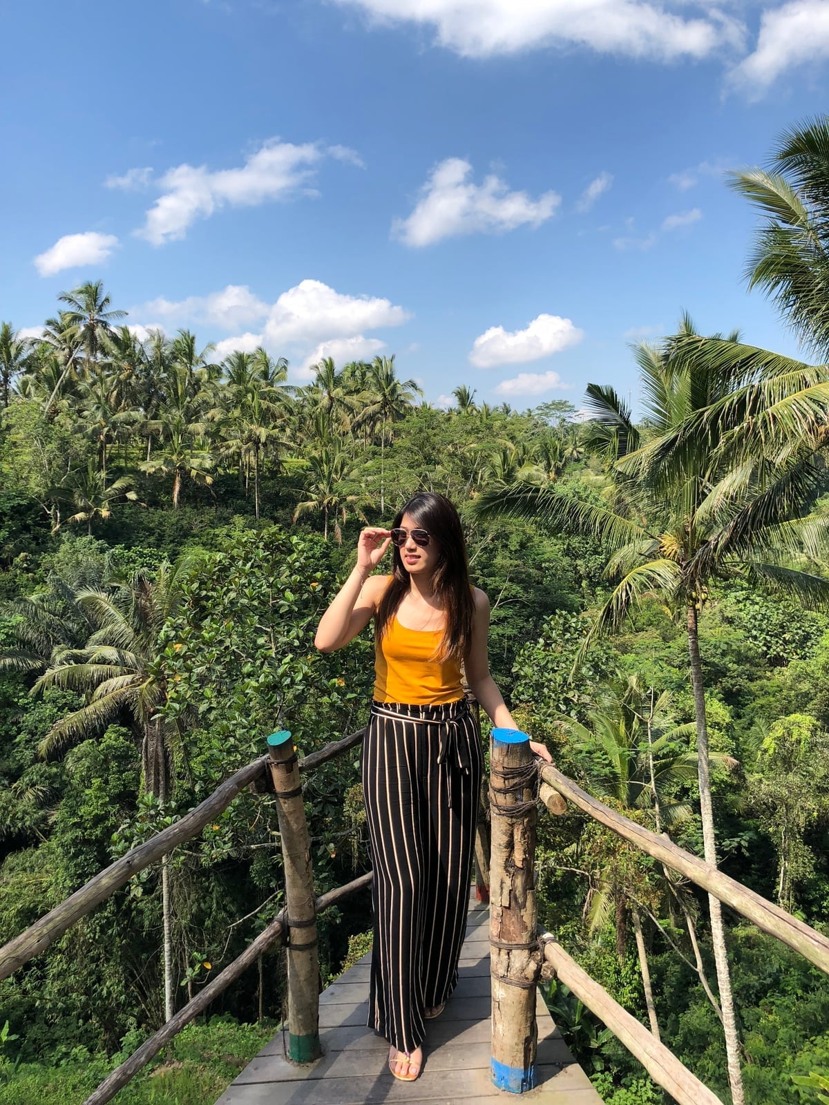Yellow tank top with striped wide-leg pants Yellow tank top with striped wide-leg pants — Bali Outfits 2027