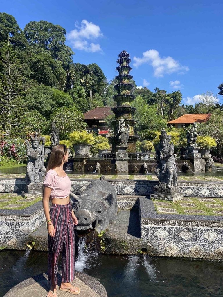 Pink crop top with striped wide-leg pants, Flat Sandals Pink crop top with striped wide-leg pants, Flat Sandals — Bali Outfits 2027