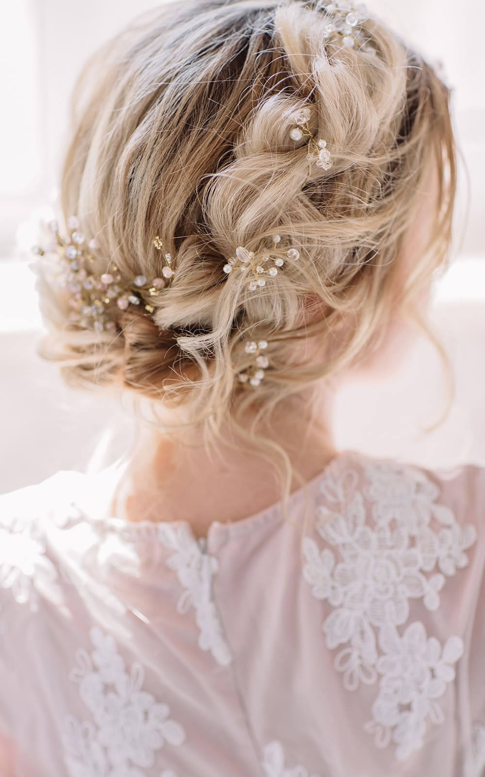 Blonde Loose Updo With Wispy Strands and Pearls Blonde Loose Updo With Wispy Strands and Pearls — Beach Wedding Hairstyles 2027