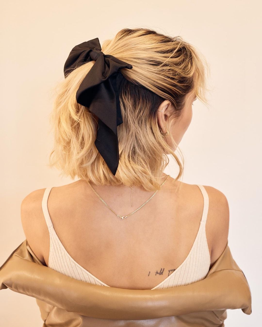 Blonde Bob With Wispy Bangs and Black Bow Blonde Bob With Wispy Bangs and Black Bow — Big Hair Bow Hairstyles 2027