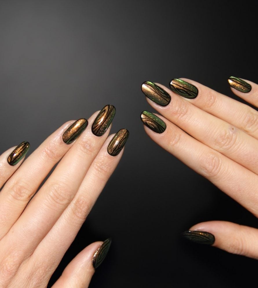 Medium Oval Deep Green Metallic Gold Lines Medium Oval Deep Green Metallic Gold Lines — Black and Gold Nails 2027