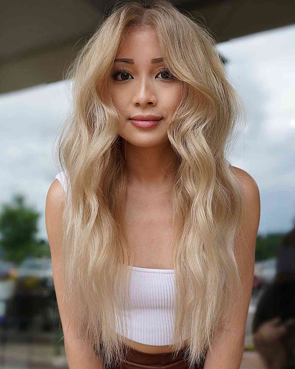 Wavy Ash Blonde Mid-Back With Curtain Bangs Wavy Ash Blonde Mid-Back With Curtain Bangs — Blonde Hair 2027 for Brown Eyes
