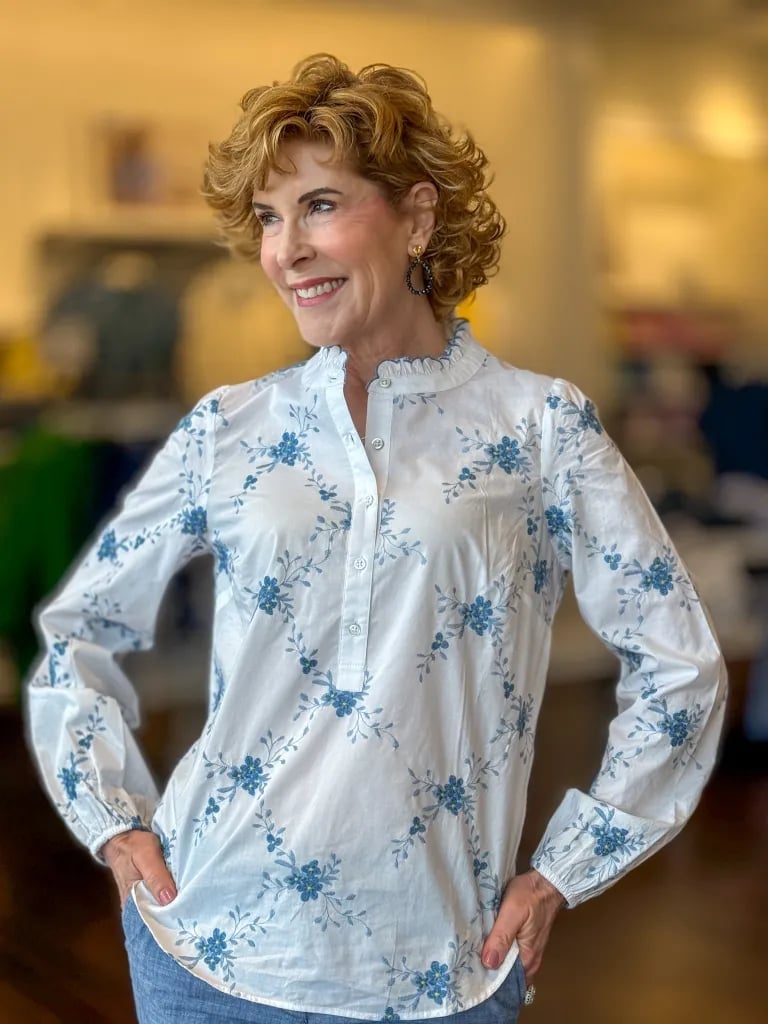 White Floral Blouse With Ruffled Neckline White Floral Blouse With Ruffled Neckline — Blouse Outfits 2027 for Women Over 50