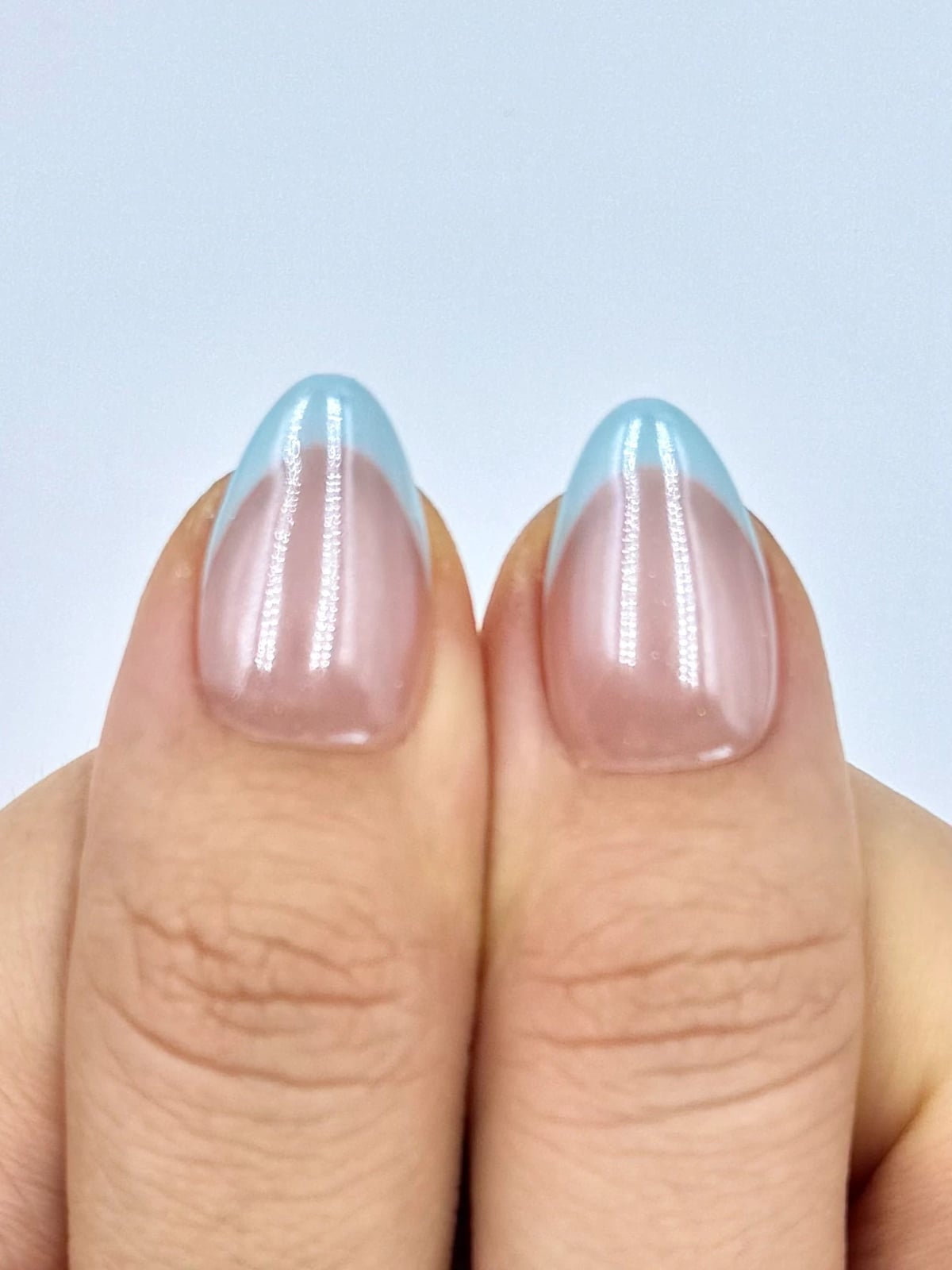 Nude Base Clean Light Blue French Tips Macro, Close-Up Take Nude Base Clean Light Blue French Tips Macro, Close-Up Take — Blue French Tip Nails 2027