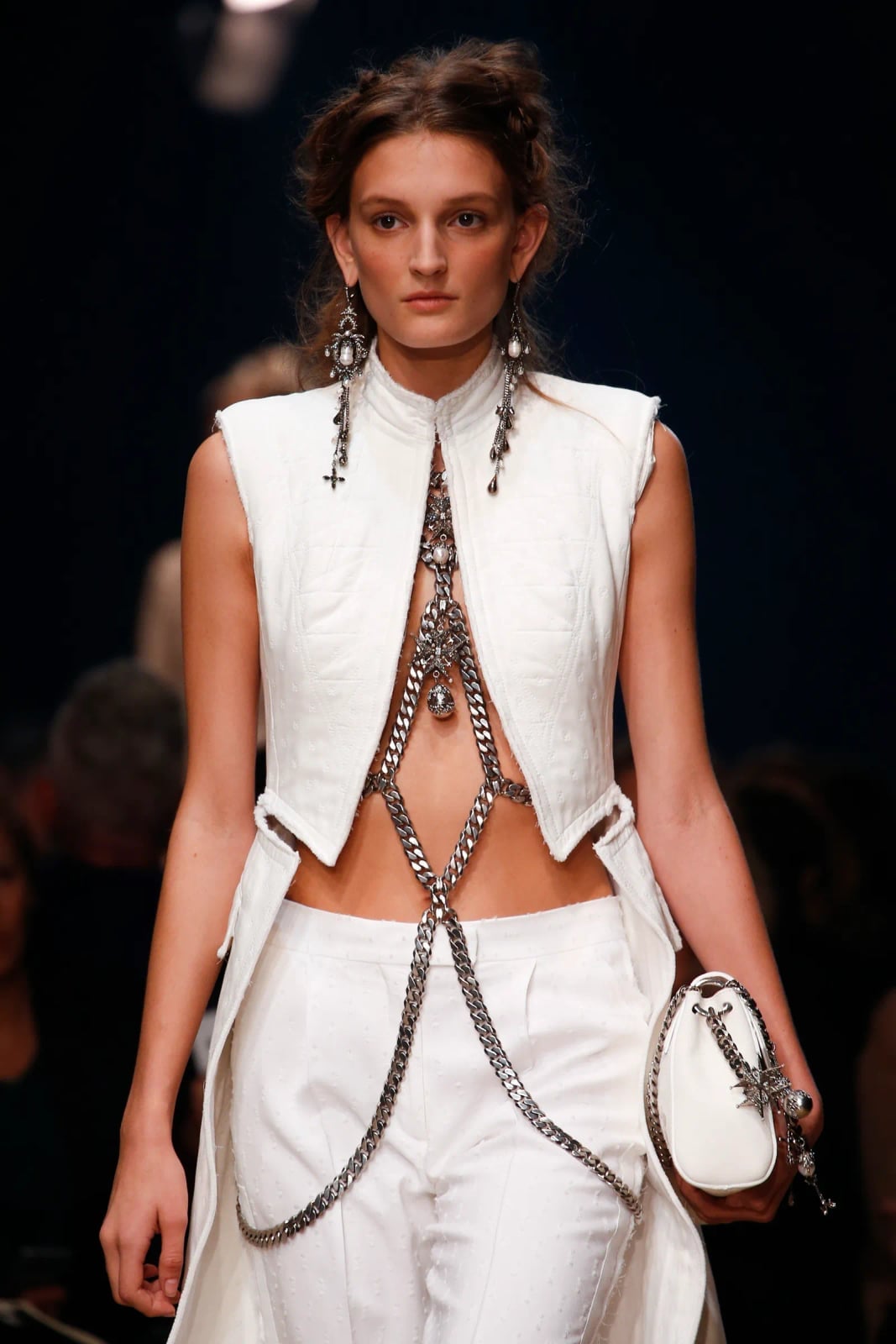 Statement silver body chain over white vest and trousers Statement silver body chain over white vest and trousers — Body Chain Outfits 2027