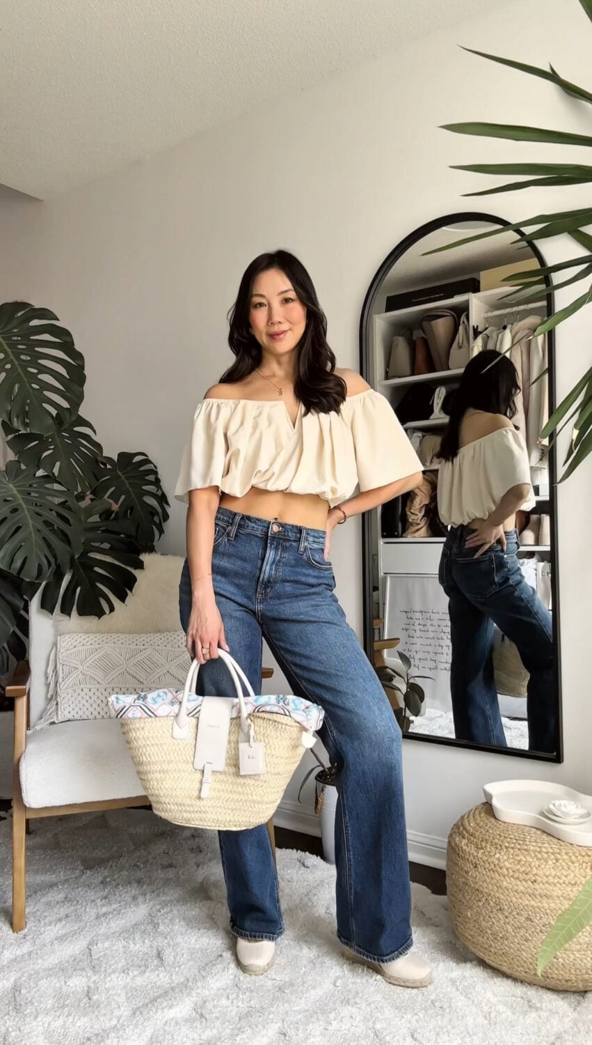 Dark Blue Bootcut Jeans With Cream Off-Shoulder Crop, Close-Up Take Dark Blue Bootcut Jeans With Cream Off-Shoulder Crop, Close-Up Take — Bootcut Jeans Outfits 2027 with Crop Top