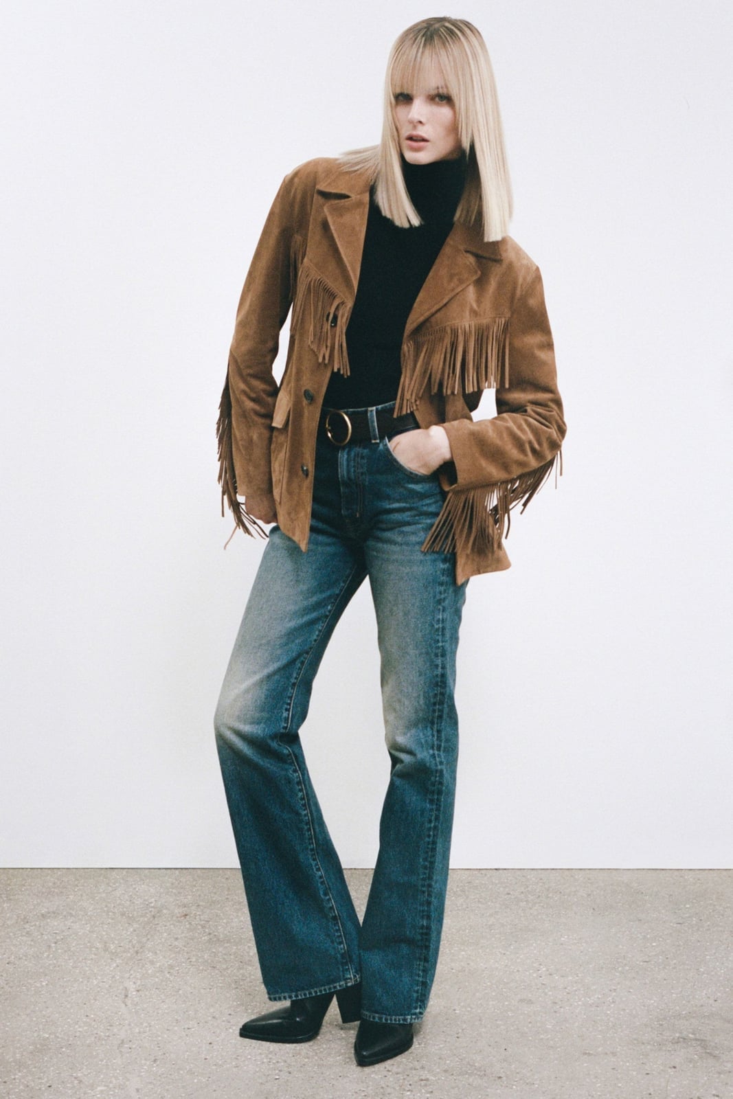Blue Bootcut Jeans With Suede Fringe Jacket And Black, Close-Up Take Blue Bootcut Jeans With Suede Fringe Jacket And Black, Close-Up Take — Bootcut Jeans Outfits 2027 with Leather Jacket