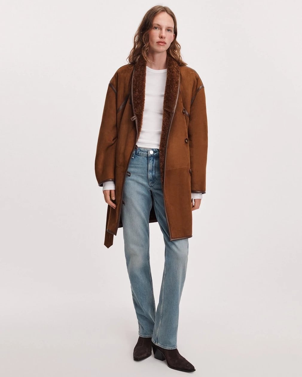 Light Blue Bootcut Jeans With White Long Sleeve Top, Close-Up Take Light Blue Bootcut Jeans With White Long Sleeve Top, Close-Up Take — Bootcut Jeans Outfits 2027 with Leather Jacket