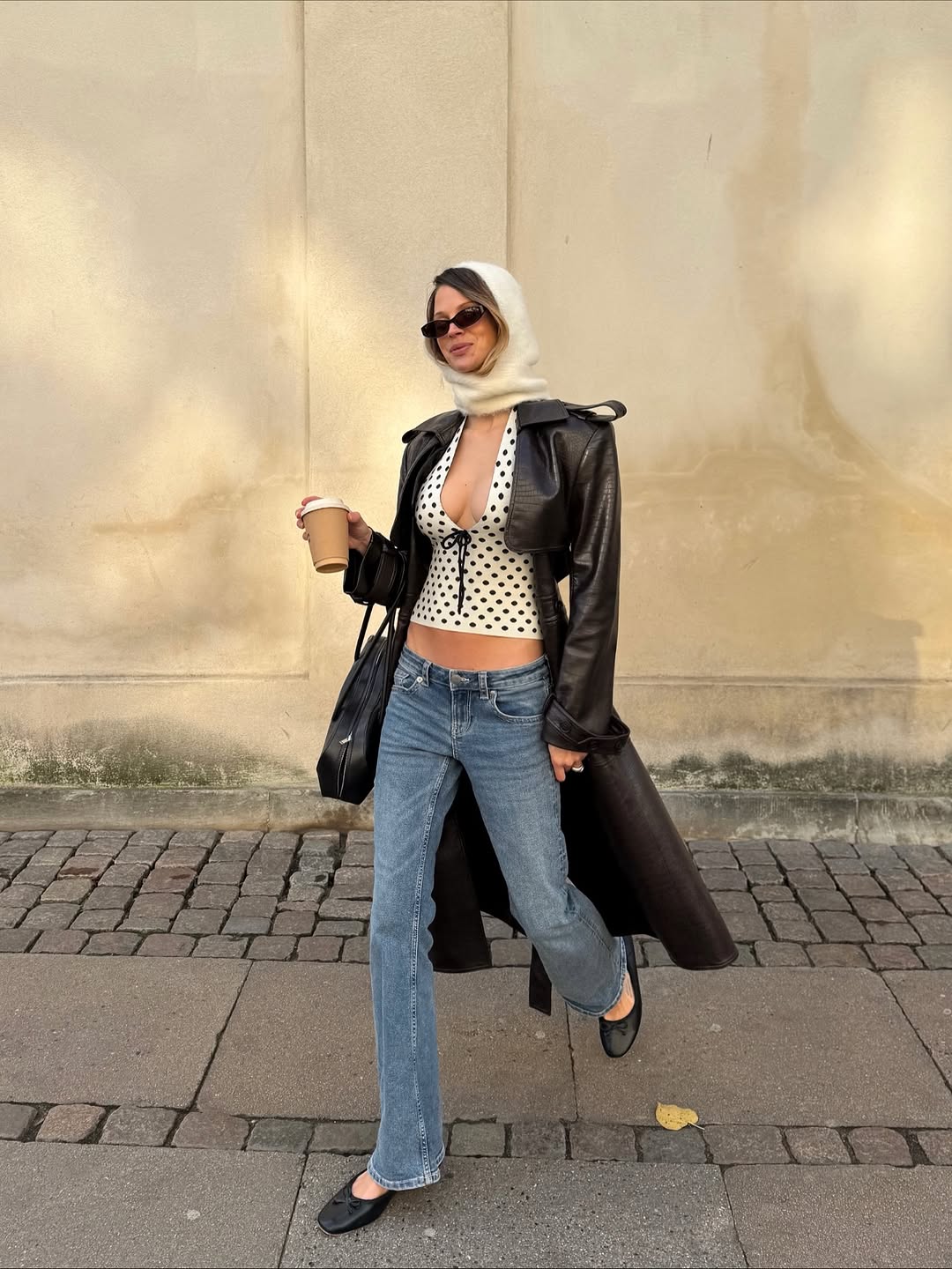 Blue Bootcut Jeans With Polka Dot Top And Black Leather, Close-Up Take Blue Bootcut Jeans With Polka Dot Top And Black Leather, Close-Up Take — Bootcut Jeans Outfits 2027 with Leather Jacket