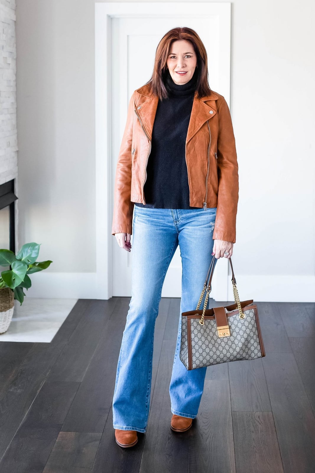 Light Blue Bootcut Jeans With Black Turtleneck And Tan, Close-Up Take Light Blue Bootcut Jeans With Black Turtleneck And Tan, Close-Up Take — Bootcut Jeans Outfits 2027 with Leather Jacket