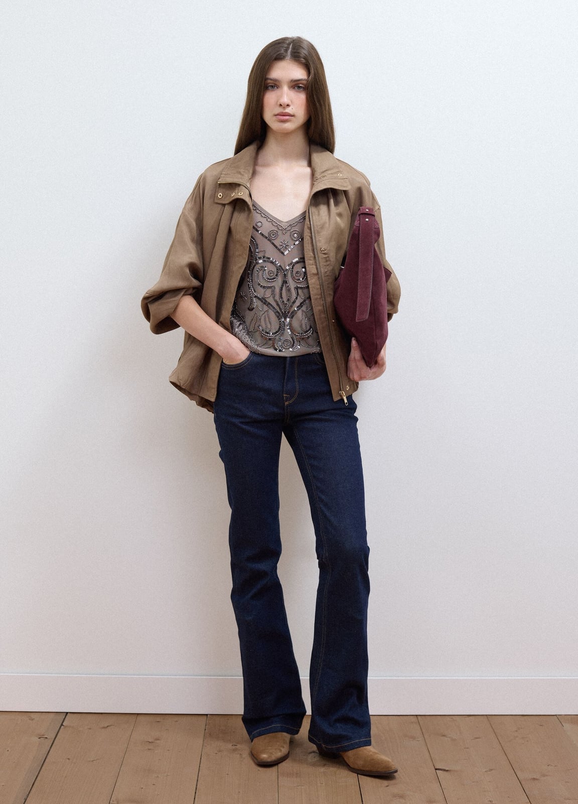 Embellished Top With Brown Bomber Jacket And Dark Wash, Close-Up Take Embellished Top With Brown Bomber Jacket And Dark Wash, Close-Up Take — Bootcut Jeans Outfits 2027 with Leather Jacket