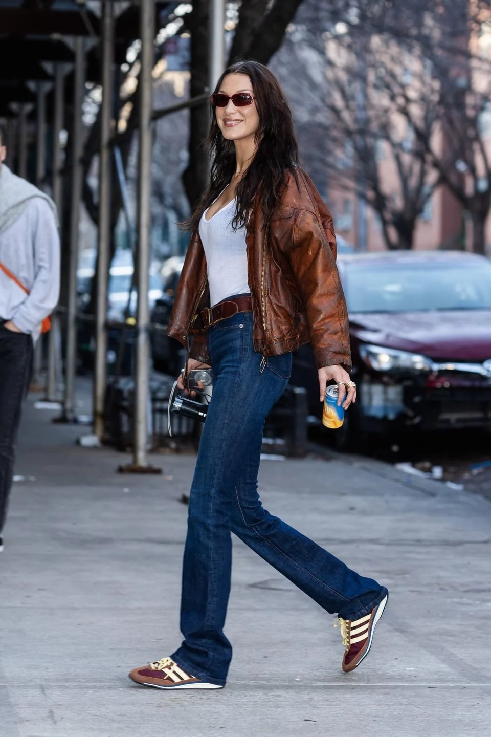 Blue Bootcut Jeans With White Tank Top And Brown, Close-Up Take Blue Bootcut Jeans With White Tank Top And Brown, Close-Up Take — Bootcut Jeans Outfits 2027 with Leather Jacket