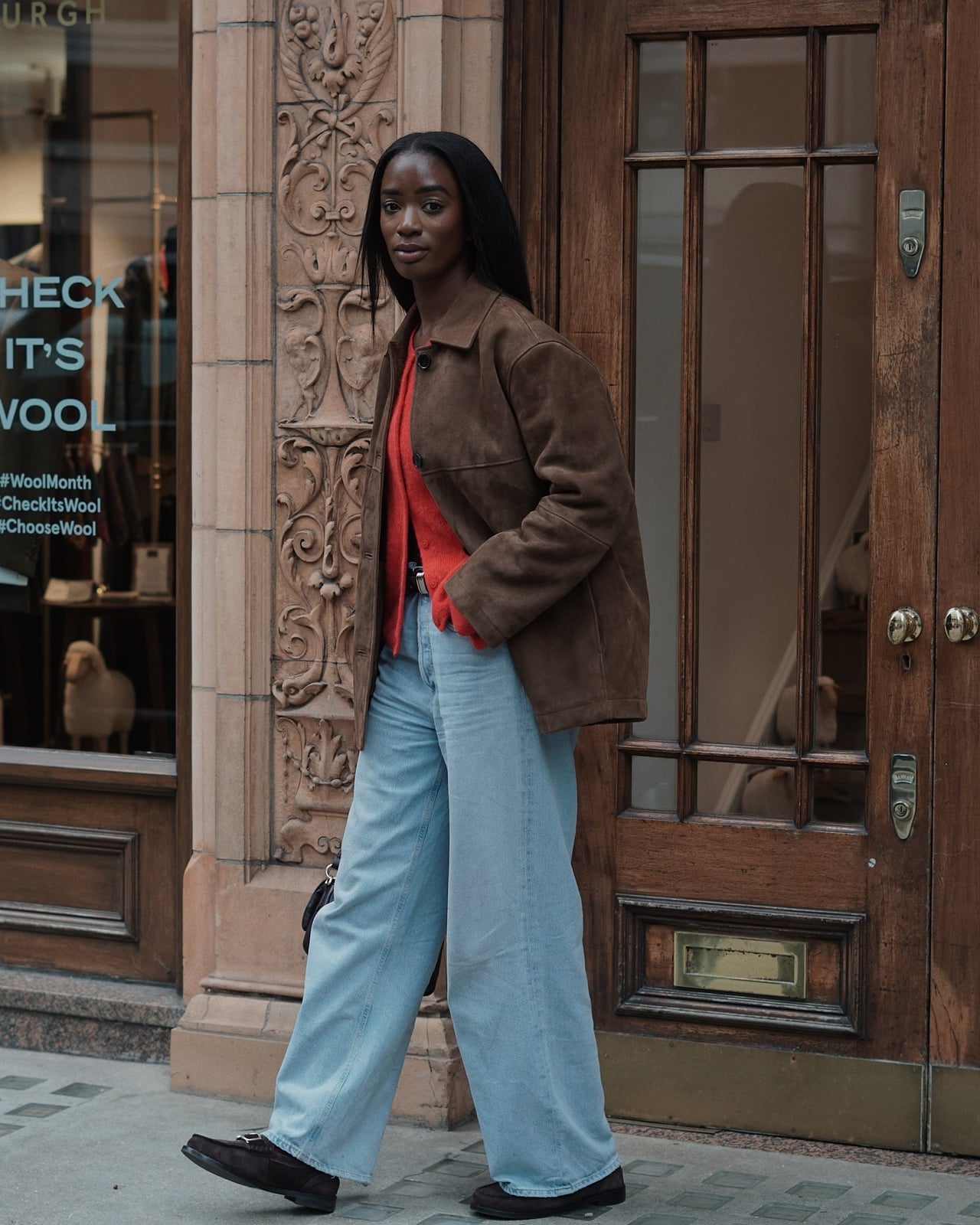 Light wash bootcut jeans with a vibrant orange sweater Light wash bootcut jeans with a vibrant orange sweater — Bootcut Jeans Outfits 2027 with Loafers