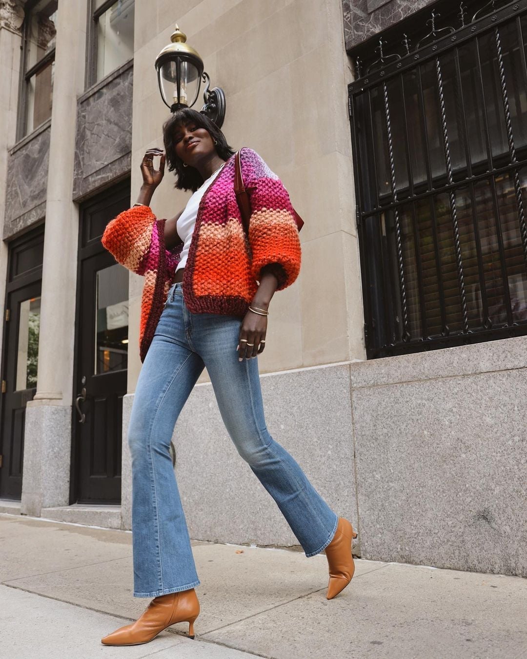 Light Blue Flare Jeans With Multicolored Chunky Cardigan Light Blue Flare Jeans With Multicolored Chunky Cardigan — Bootcut Jeans Outfits 2027 with Sweater