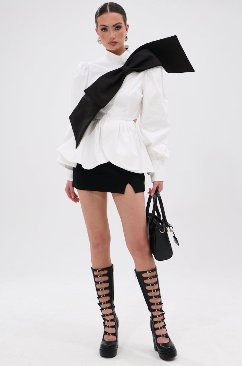 White Peplum Blouse With Oversized Black Bow White Peplum Blouse With Oversized Black Bow — Bow Blouse Outfits 2027