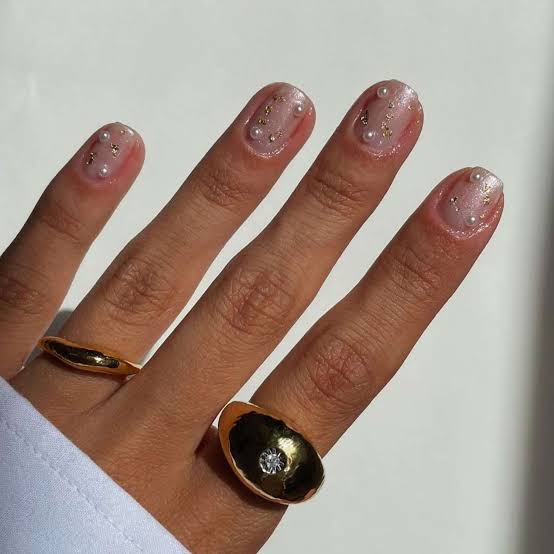 Short Almond Nails With Pearls and Gold Flakes Short Almond Nails With Pearls and Gold Flakes — Bridal Shower Nails 2027