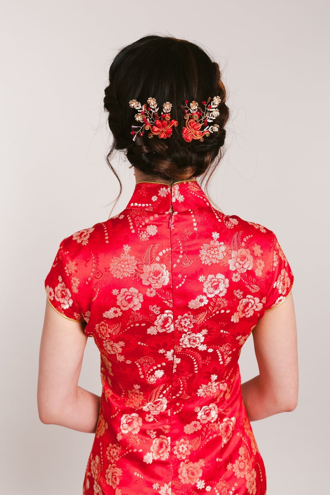 Neat Low Bun With Floral Accessory Neat Low Bun With Floral Accessory — Chinese Wedding Hairstyles 2027