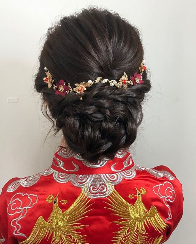 Braided Low Bun With Floral Accents Braided Low Bun With Floral Accents — Chinese Wedding Hairstyles 2027
