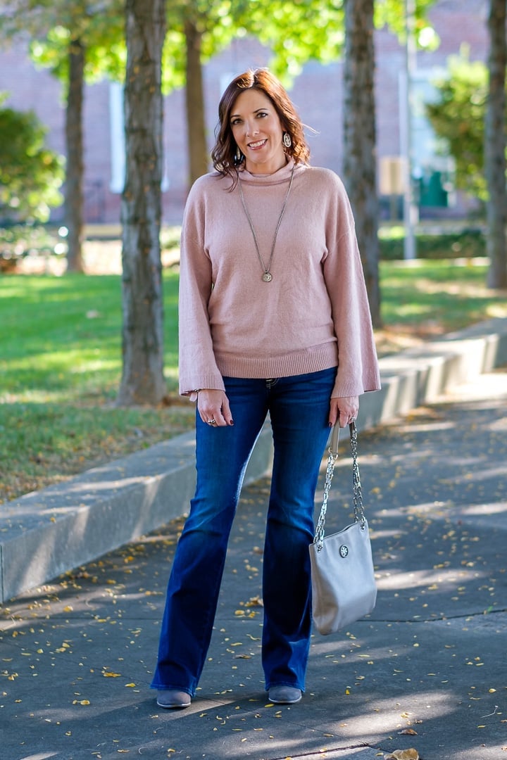 Pink Bell-Sleeve Sweater With Dark Wash Bootcut Jeans, Close-Up Take Pink Bell-Sleeve Sweater With Dark Wash Bootcut Jeans, Close-Up Take — Church Bootcut Jeans Outfits 2027