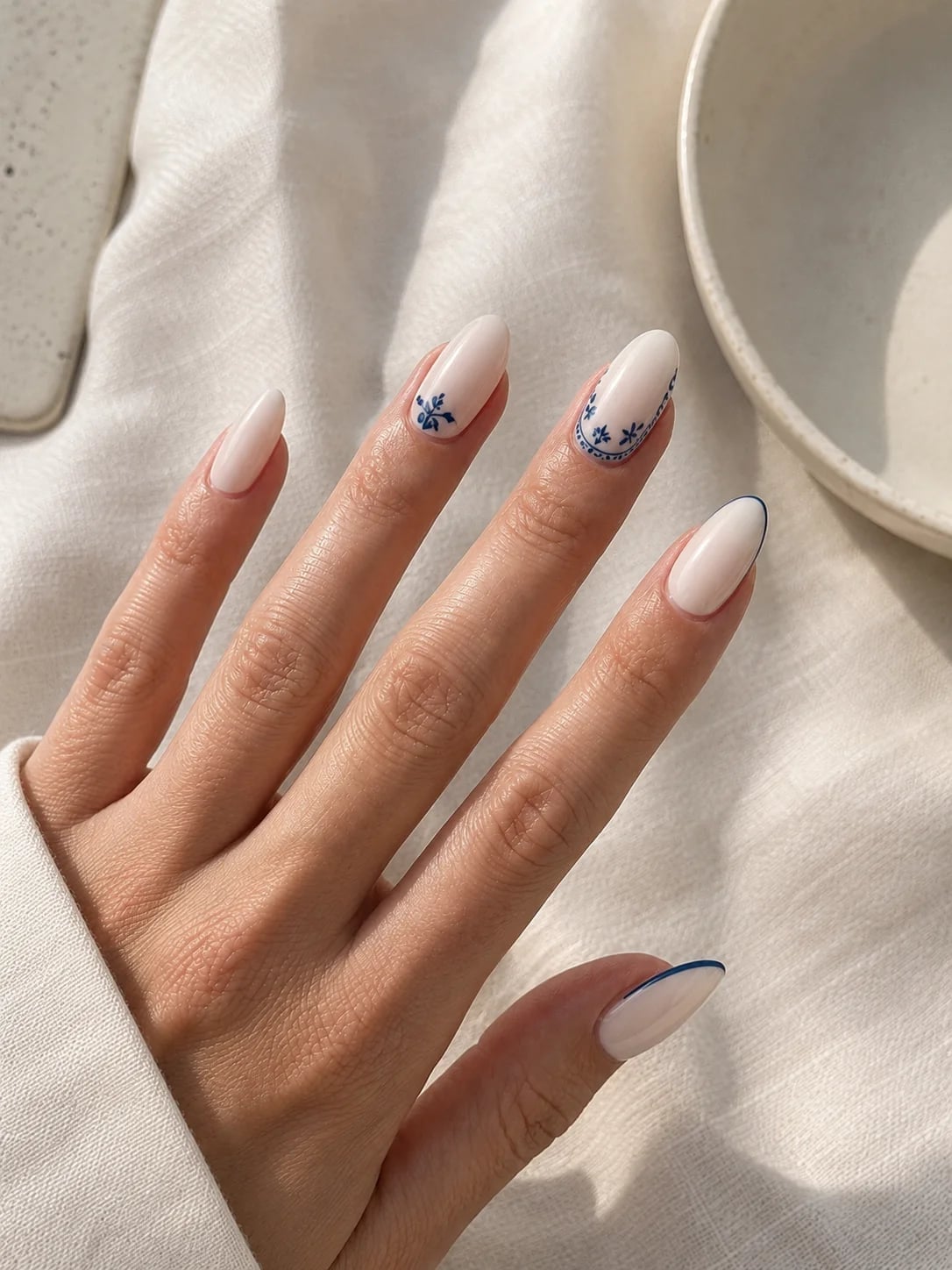 Off-White Blue Floral Outline Short Almond Nails Off-White Blue Floral Outline Short Almond Nails — Classy Short Nails 2027