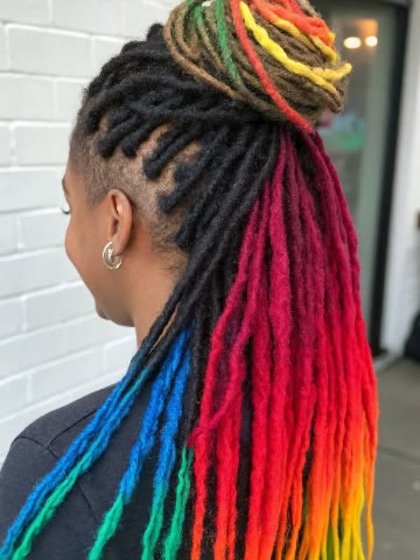 Mid-Back Locs Updo With Rainbow Highlights Mid-Back Locs Updo With Rainbow Highlights — Colored Locs 2027