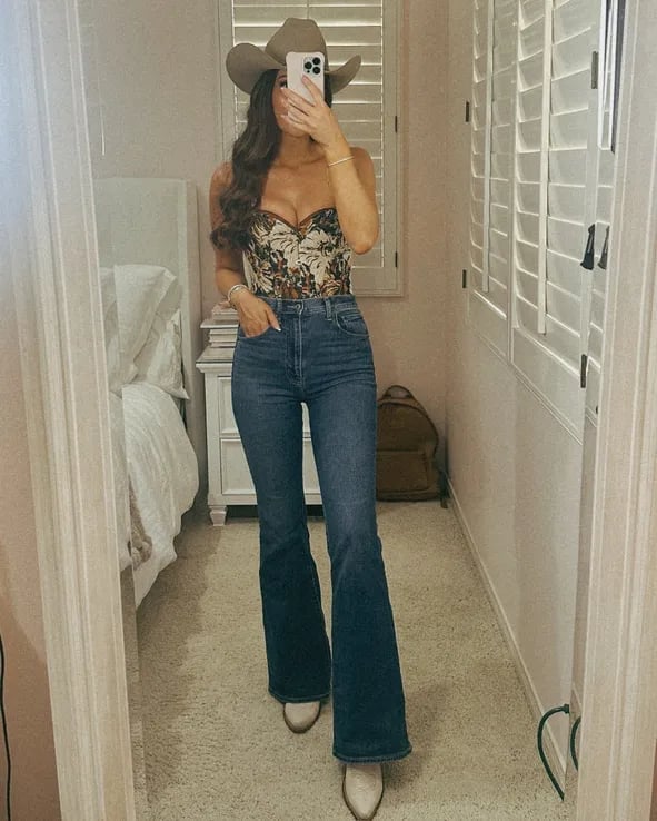High-waisted flare jeans with a floral corset and cowboy hat — Concert Bootcut Jeans Outfits 2027