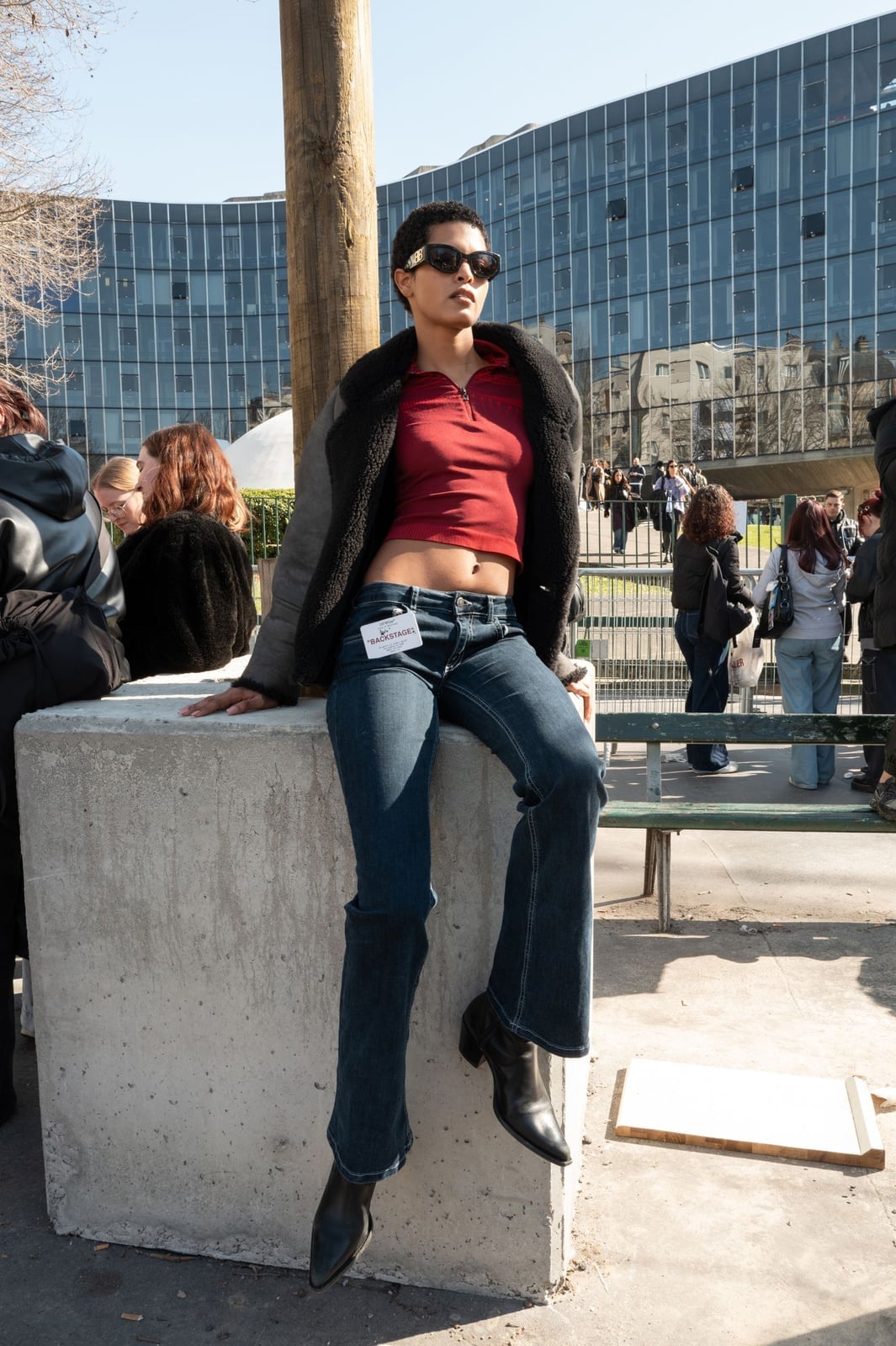 Dark blue bootcut jeans with a red polo and shearling jacket — Concert Bootcut Jeans Outfits 2027