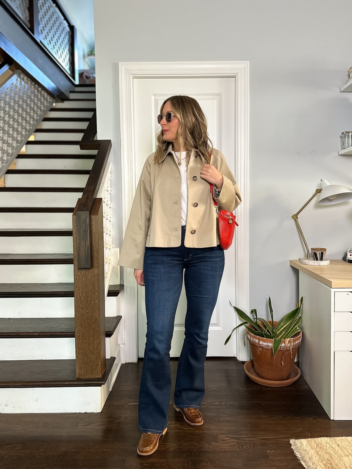 Dark wash bootcut jeans with a tan cropped jacket — Concert Bootcut Jeans Outfits 2027