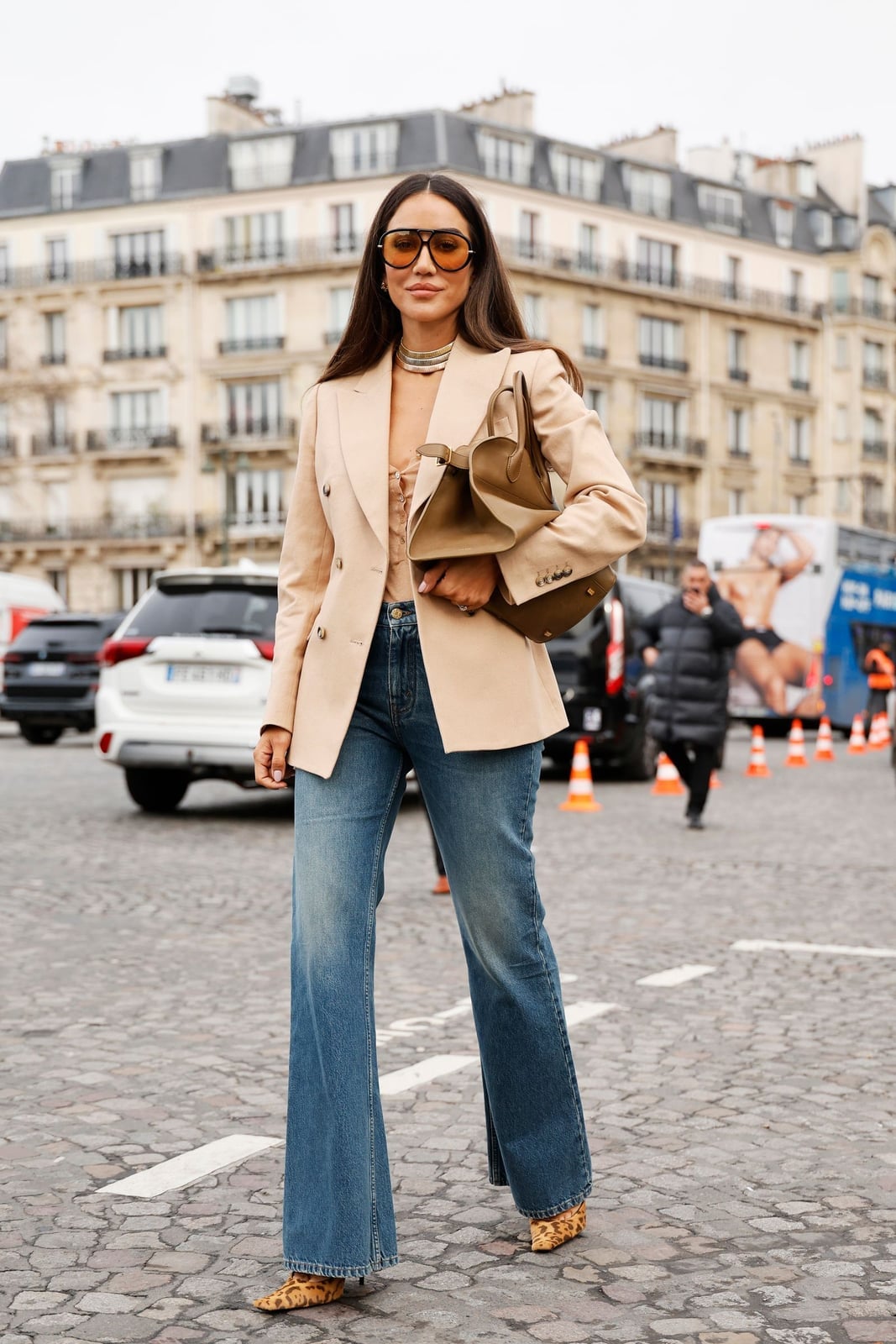 Blue bootcut jeans with a beige corset top and oversized blazer — Concert Bootcut Jeans Outfits 2027